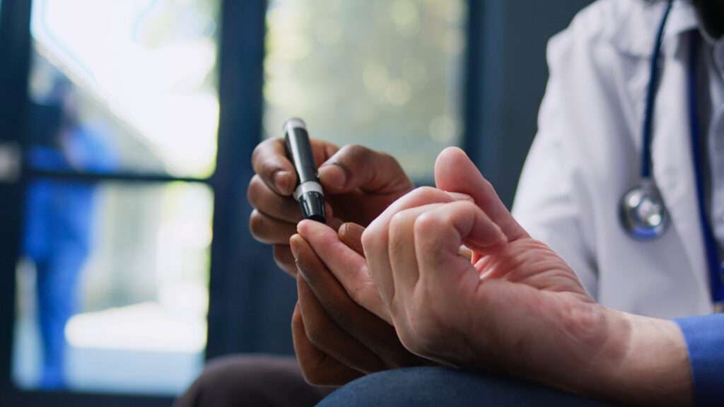 Doctor consulting senior diabetes patient at Supreme Hospital